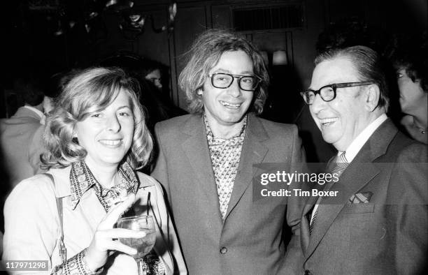 American journalist Earl Wilson shares a laugh with Barbara Lewis and Village Voice columnist and Gay Rights activist Arthur Bell at the publication...