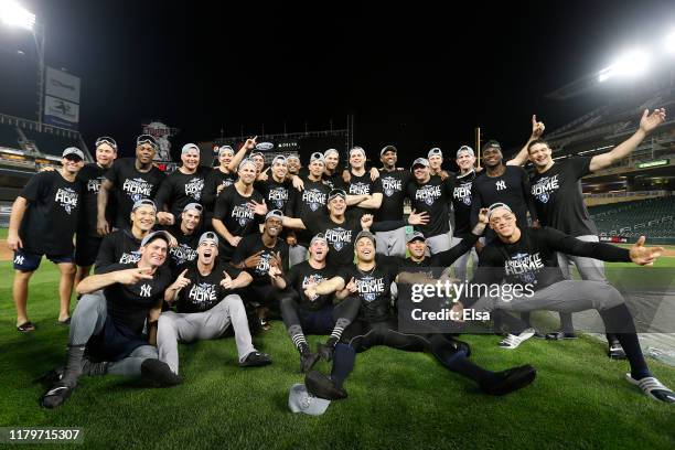 The New York Yankees celebrate after defeating the Minnesota Twins 5-1 in game three of the American League Division Series to advance to the...