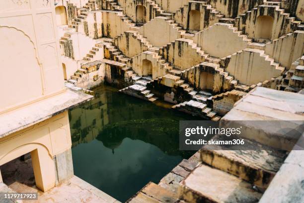 ancient stepwell chand baori biggest stepwell near jaipur rajasthan india - biggest dam stock pictures, royalty-free photos & images