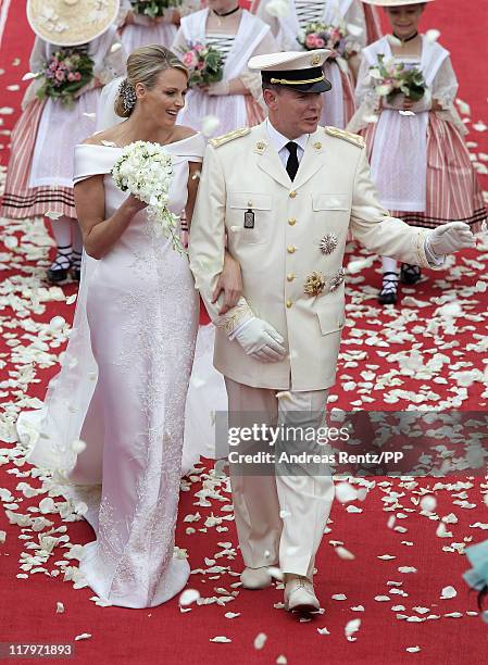 Princess Charlene of Monaco and Prince Albert II of Monaco leave the religious ceremony of the Royal Wedding of Prince Albert II of Monaco to...