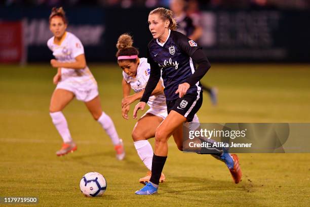 Allie Long of Seattle Reign FC moves the ball down the pitch during the match against the Utah Royals FC at Cheney Stadium on September 25, 2019 in...