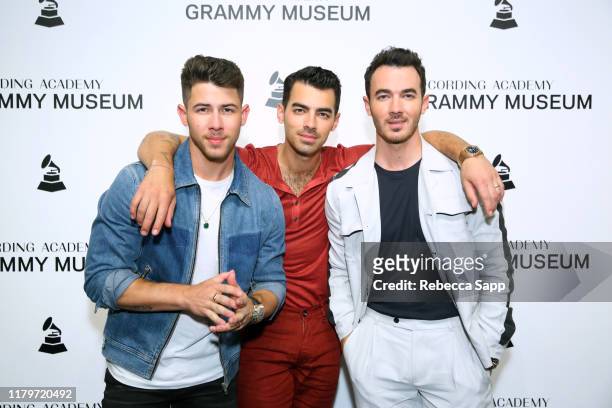 Nick Jonas, Joe Jonas, and Kevin Jonas attend An Evening With The Jonas Brothers at the GRAMMY Museum on October 07, 2019 in Los Angeles, California.