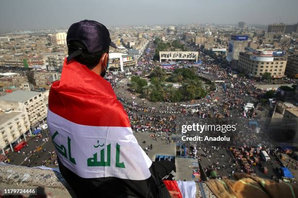 Protestors gather to attend ongoing anti-government demonstrations economic reforms and overhaul of the political system, at Tahrir Square in...