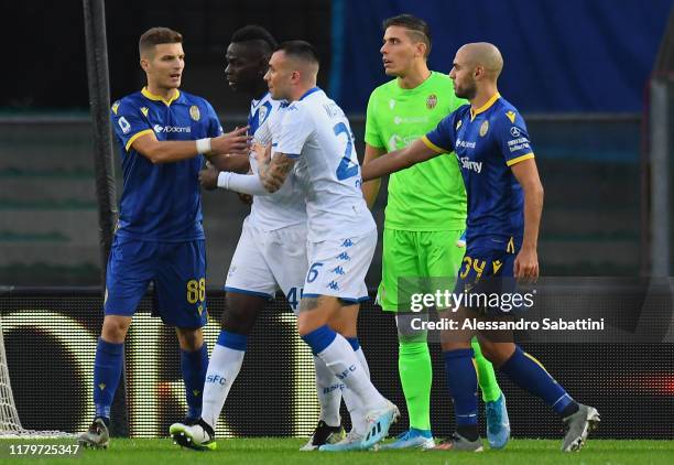 Mario Balotelli of Brescia Calcio reacts to racist chants from Verona fans during the Serie A match between Hellas Verona and Brescia Calcio at...