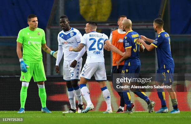 Mario Balotelli of Brescia Calcio reacts to racist chants from Verona fans during the Serie A match between Hellas Verona and Brescia Calcio at...