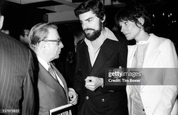 American journalist Earl Wilson , speaks with married American actors Richard Benjamin and Paula Prentiss during the publication party for Wilson's...