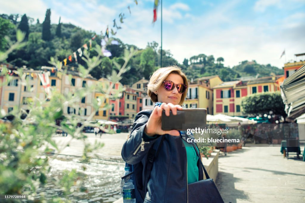 Tourist in Portofino making selfie