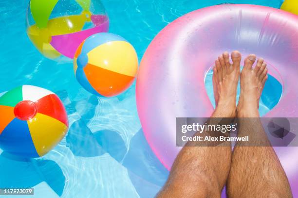 summer feet - man on float stock pictures, royalty-free photos & images