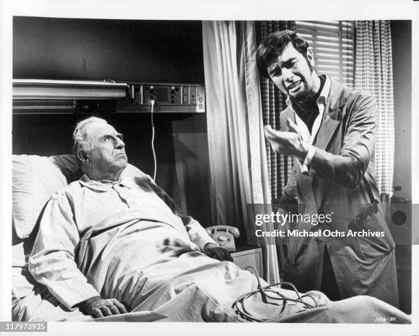 Charles Robinson tries to convince hospitalized Ed Begley that his nephew can be a big recording star in a scene from the film 'A Time to Sing', 1968.