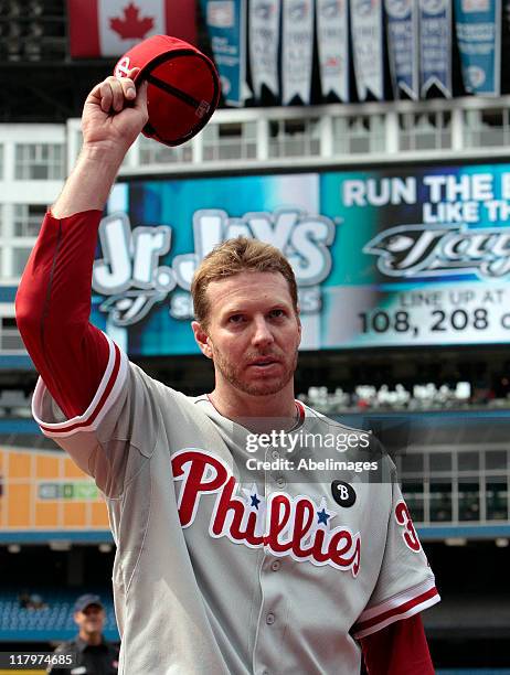 Roy Halladay of the Philadelphia Phillies waves after a complete game win against the Toronto Blue Jays during MLB action at The Rogers Centre July...