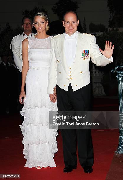 Princess Charlene of Monaco and Prince Albert II of Monaco attend the official dinner and firework celebrations at the Opera Terraces after the...
