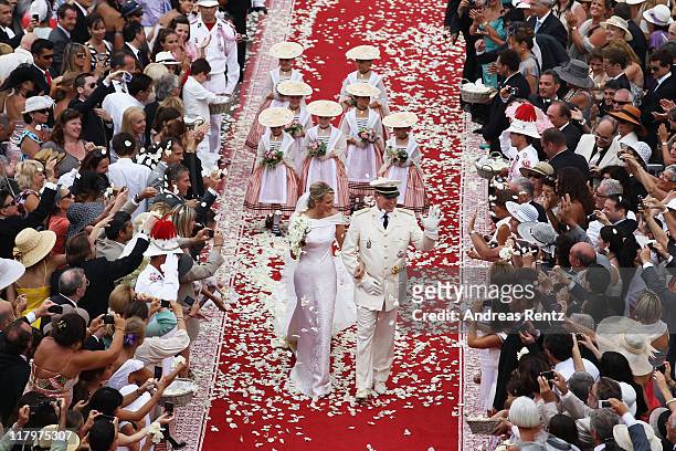 Princess Charlene of Monaco and Prince Albert II of Monaco leave the religious ceremony of the Royal Wedding of Prince Albert II of Monaco to...