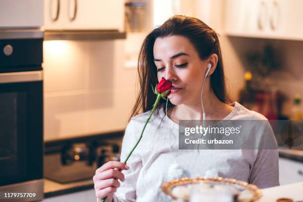 young woman smelling rose - wilted plant stock pictures, royalty-free photos & images
