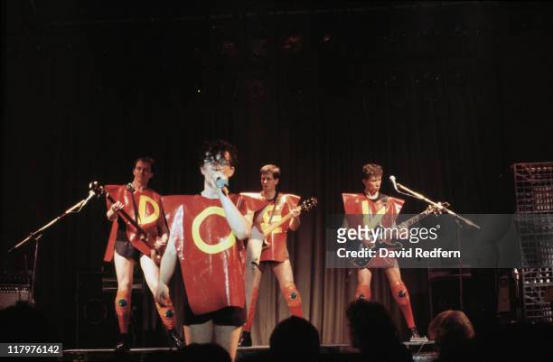 Bassist Gerald Casale, singer Mark Mothersbaugh, guitarist Bob Mothersbaugh and guitarist Bob Casale), US New Wave band, dressed in red plastic...