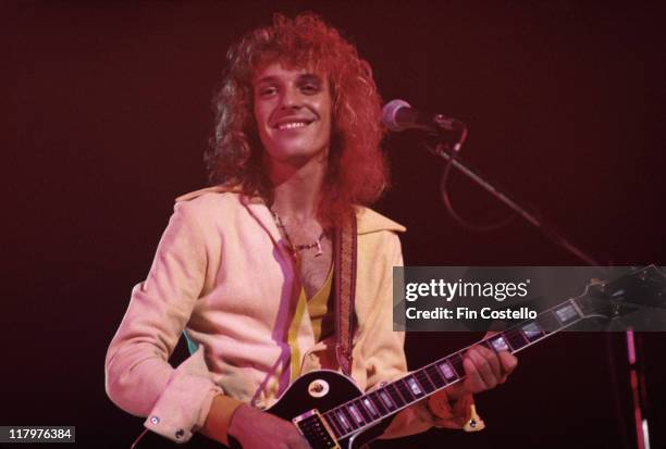 Peter Frampton, British singer and guitarist, playing a Gibson Les Paul guitar on stage during a live concert performance, circa 1976.