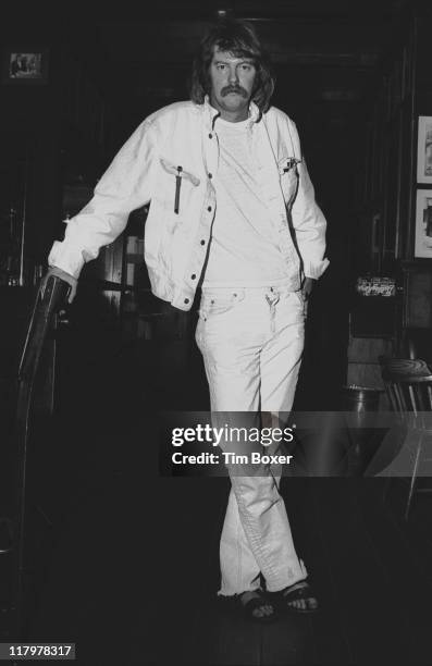 Portrait of American actor Troy Donahue , dressed in white denim and sandals, as he poses in Gallagher's Restaurant, New York, New York, May 1971.