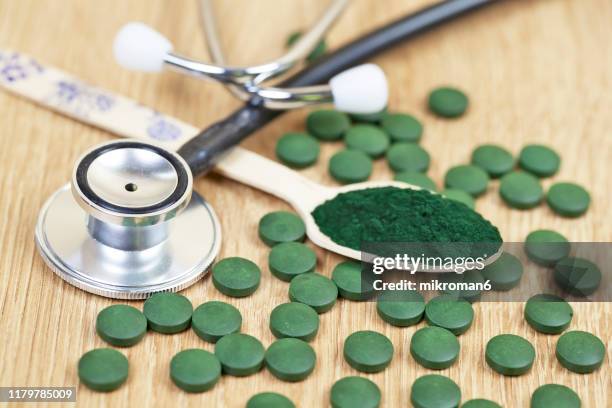 organic spirulina (blue-green algae) - chlorella stock pictures, royalty-free photos & images