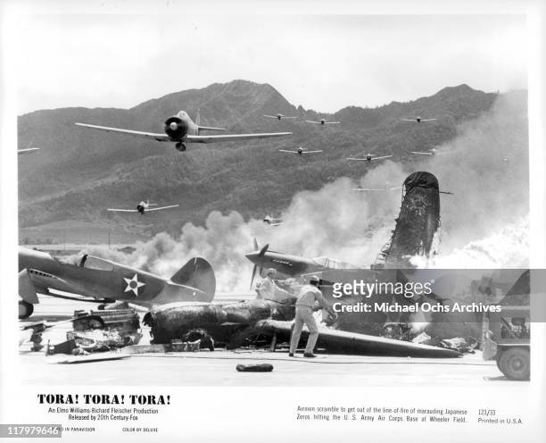 Airmen scramble to get out of the way of marauding Japanese Zeros in a scene from the film 'Tora! Tora! Tora!', 1970.