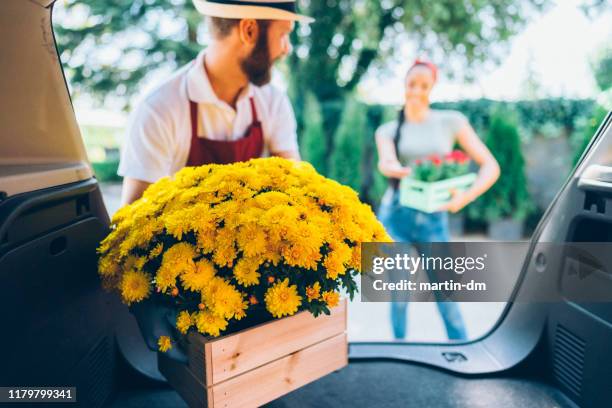 home delivery of flowers - unloading stock pictures, royalty-free photos & images