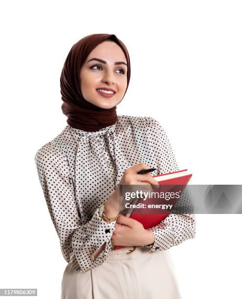 muslimische junge frau - arab businesswoman with books stock-fotos und bilder