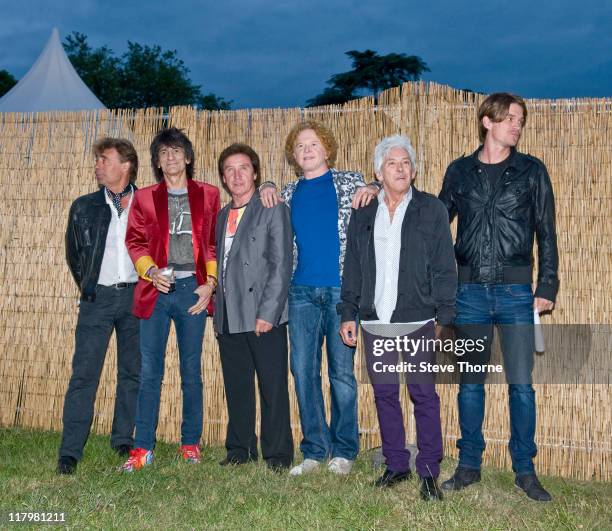 Glen Matlock, Ronnie Wood, Kenney Jones, Mick Hucknall and Ian McLagan of The Faces pose backstage during the second day of Cornbury Festival on July...