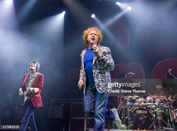 Ronnie Wood and Mick Hucknall of The Faces perform on stage during the second day of Cornbury Festival on July 2, 2011 in Oxford, United Kingdom.