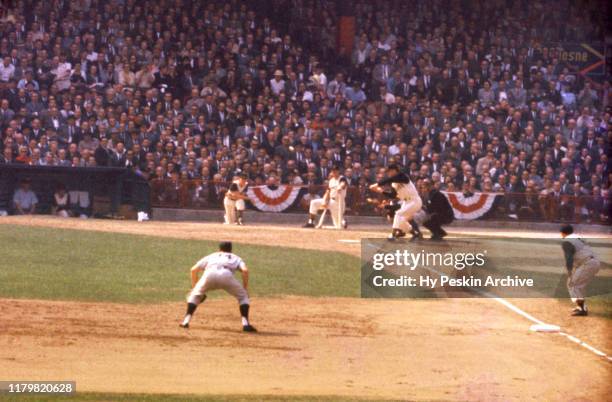 Bill Mazeroski of the Pittsburgh Pirates gets ready to bunt as third baseman Clete Boyer of the New York Yankees defends during Game 7 of the 1960...