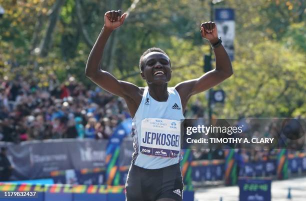 Joyciline Jepkosgei of Kenya crosses the finish line to win the Professional Women's Finish during the 2019 TCS New York City Marathon in New York on...