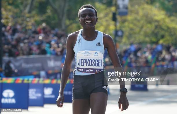 Joyciline Jepkosgei of Kenya crosses the finish line to win the Professional Women's Finish during the 2019 TCS New York City Marathon in New York on...