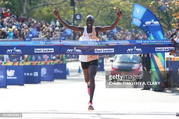 Geoffrey Kamworor of Kenya crosses the finish line to win the Professional Men's during the 2019 TCS New York City Marathon in New York on November...
