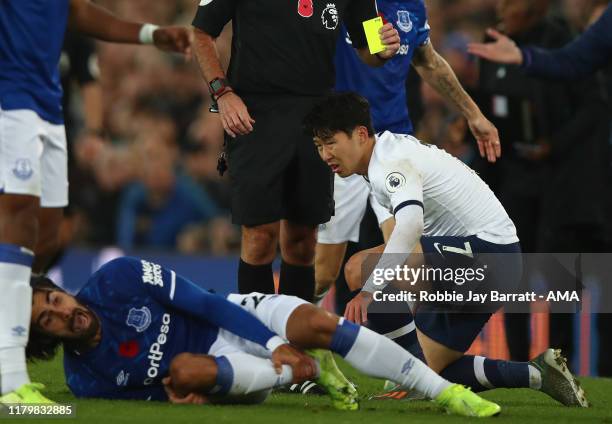 Son Heung-min of Tottenham Hotspur looks on in horror after a tackle on Andre Gomes of Everton which resulted in a red card and Gomes suffering an...