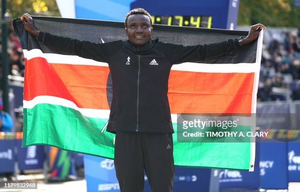 Joyciline Jepkosgei of Kenya poses after winning the Professional Women's Finish during the 2019 TCS New York City Marathon in New York on November...