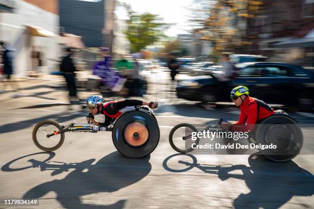 Wheel chair leaders are seen just past the 15k mark during the 2019 TCS New York City Marathon on November 3, 2019 in New York City.