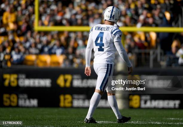 Adam Vinatieri of the Indianapolis Colts walks off the field after missing an extra point in the third quarter during the game against the Pittsburgh...