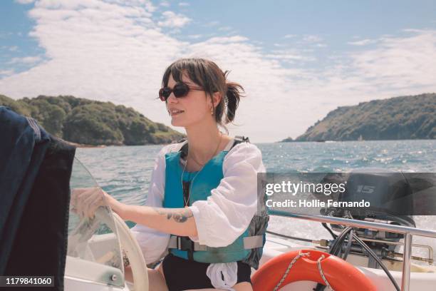 boat outing on british bay - life jacket stock pictures, royalty-free photos & images