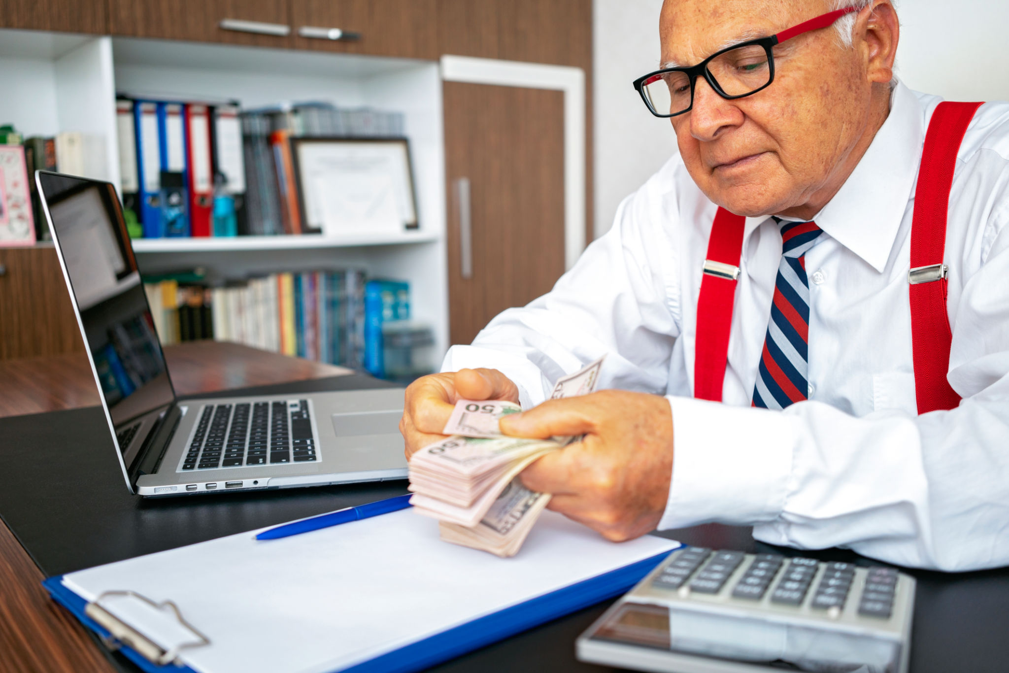 Senior business man counting money. Senior business man counting money.