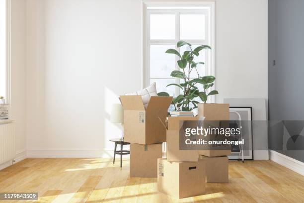 cardboard boxes  at new apartment - abandoned room stock pictures, royalty-free photos & images