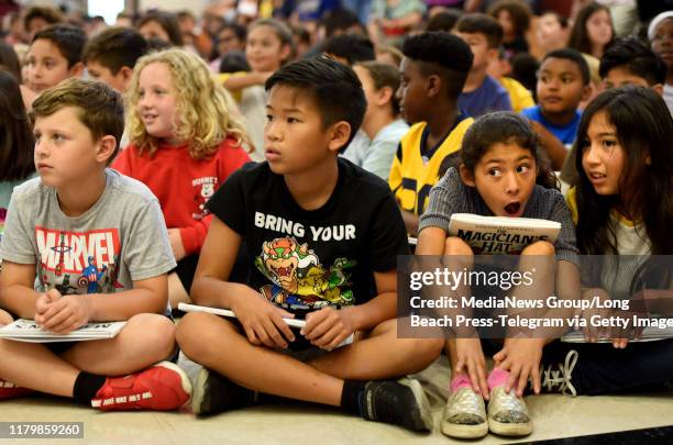 Students at Peter Burnett, Elementary School watch a magic show before reading along with Los Angeles Rams running back Todd Gurley and his former...