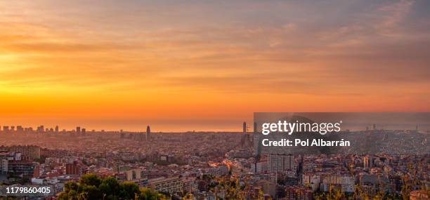 skyline of barcelona during sunrise. catalonia, spain - tibidabo stockfoto's en -beelden