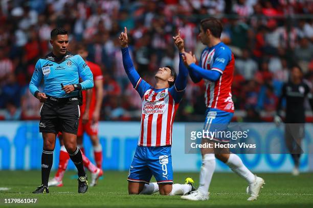 Alan Pulido of Chivas celebrates after scoring the third goal of his team during the 17th round match between Toluca and Chivas as part of the Torneo...