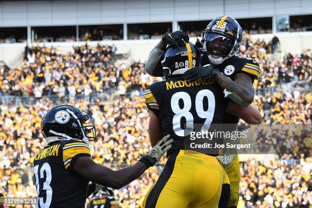 Vance McDonald of the Pittsburgh Steelers celebrates his touchdown with Jaylen Samuels during the third quarter against the Indianapolis Colts at...