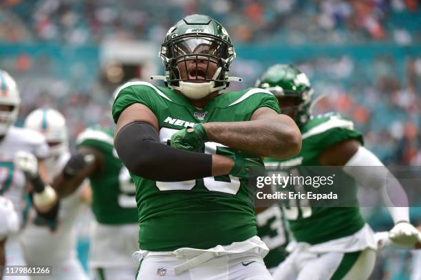 Quinnen Williams of the New York Jets celebrates after sacking Ryan Fitzpatrick of the Miami Dolphins during the first quarter of the game at Hard...