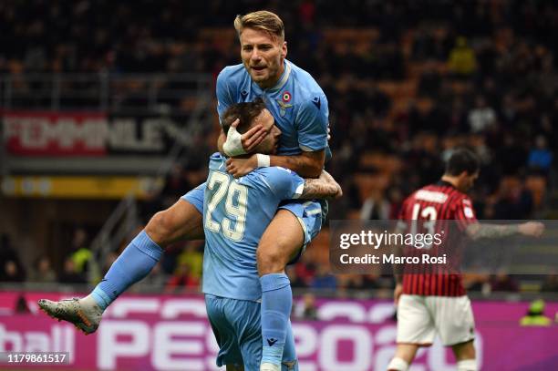 Ciro Immobile of SS Lazio celebrate a opening goal with his team mates during the Serie A match between AC Milan and SS Lazio at Stadio Giuseppe...