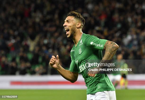 Saint-Etienne's Gabonese forward Denis Bouanga reacts after scoring during the French L1 football match between AS Saint-Etienne and AS Monaco at the...