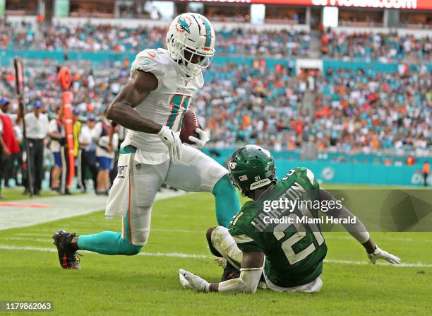 Miami Dolphins receiver DeVante Parker catches a second quarter touchdown as New York Jets' Nate Hairston fails to defend on Sunday, Nov. 3, 2019 at...