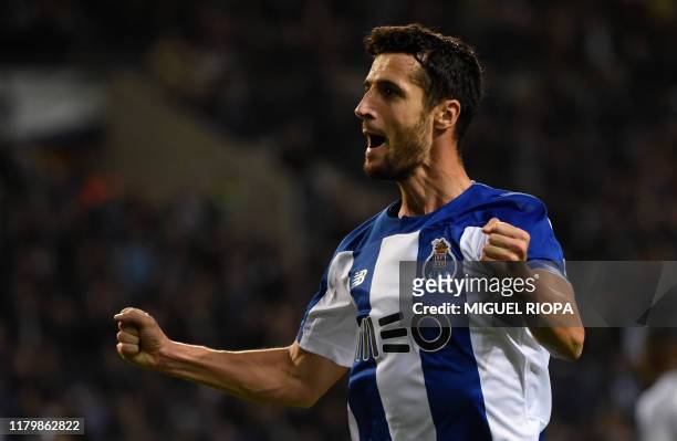 Porto's Spanish defender Ivan Marcano celebrates after scoring a goal during the Portuguese League football match between FC Porto and CD Aves on at...