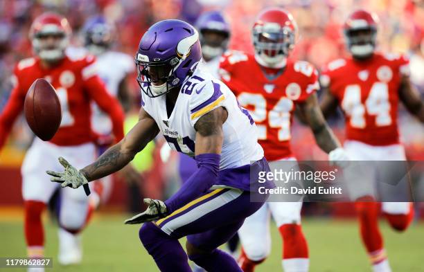 Mike Hughes of the Minnesota Vikings fumbles a fair catch punt in the fourth quarter against the Kansas City Chiefs at Arrowhead Stadium on November...