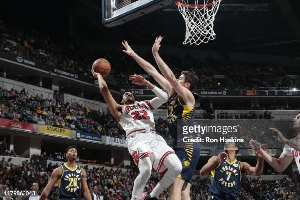 Otto Porter Jr. #22 of the Chicago Bulls shoots the ball against T.J. Leaf of the Indiana Pacers on November 3, 2019 at Bankers Life Fieldhouse in...