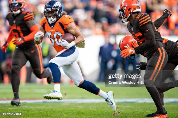 Phillip Lindsay of the Denver Broncos runs the ball during the first half of a game against the Cleveland Browns at Broncos Stadium at Mile High on...