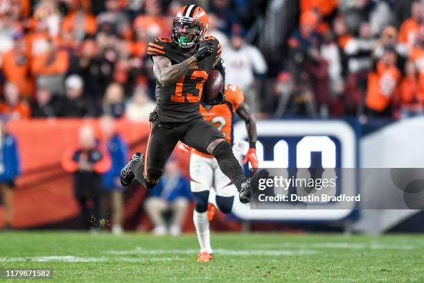 Odell Beckham of the Cleveland Browns leaps as he runs for a first down after a catch in the fourth quarter of a game against the Denver Broncos at...